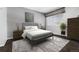 Bedroom with a neutral color palette with gray walls, modern furniture, and a rug at 3742 S Granby Way, Aurora, CO 80014