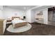 Bright bedroom with a woven rug, neutral colors, and a built-in desk area at 3742 S Granby Way, Aurora, CO 80014