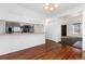 Open-concept dining room features hardwood floors and access to the kitchen at 3742 S Granby Way, Aurora, CO 80014