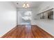 Bright dining room features hardwood floors and a sliding glass door for natural light at 3742 S Granby Way, Aurora, CO 80014