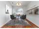 Bright dining room features hardwood floors and a sliding glass door for natural light at 3742 S Granby Way, Aurora, CO 80014