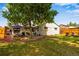 Manicured backyard features a patio with lounge seating and a grilling area, perfect for outdoor entertaining at 5620 E Cornell Ave, Denver, CO 80222