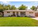 Charming single-story home with a well-manicured lawn and welcoming front entrance at 5620 E Cornell Ave, Denver, CO 80222