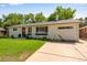 Charming single-story home with a well-manicured lawn and welcoming front entrance at 5620 E Cornell Ave, Denver, CO 80222