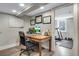 Home office features a well-lit desk space and adjacent workout area at 5620 E Cornell Ave, Denver, CO 80222