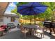 Cozy patio area with outdoor dining set, lounge seating and a grill, perfect for entertaining and relaxation at 5620 E Cornell Ave, Denver, CO 80222