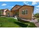 Exterior of home with a backyard featuring a hammock and lush lawn at 15616 Soo Line Way, Monument, CO 80132