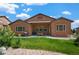 Exterior view of a home with a covered patio, grill, and well-maintained backyard at 15616 Soo Line Way, Monument, CO 80132