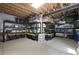 Organized basement storage area with shelving units and exposed ceiling beams at 15616 Soo Line Way, Monument, CO 80132