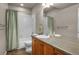Bathroom with vanity, mirror, and tiled bath-shower at 15616 Soo Line Way, Monument, CO 80132