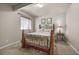 Bedroom with a decorative metal bed frame and window at 15616 Soo Line Way, Monument, CO 80132