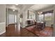 Elegant dining room features hardwood floors, modern lighting, and large windows offering ample natural light at 15616 Soo Line Way, Monument, CO 80132