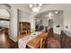 Dining room with wood table set, hardwood floors, and arched doorway at 15616 Soo Line Way, Monument, CO 80132