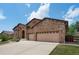 Stunning home with stone accents, a spacious three-car garage and extended driveway for ample parking at 15616 Soo Line Way, Monument, CO 80132