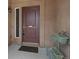 Exterior: Covered entrance with decorative side window, secure lockbox, and plant stand at 15616 Soo Line Way, Monument, CO 80132