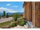 Exterior view of the house steps, landscaping, and a glimpse of the mountain landscape at 15616 Soo Line Way, Monument, CO 80132