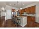 Kitchen island featuring barstool seating and wooden cabinets at 15616 Soo Line Way, Monument, CO 80132