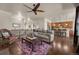 Open-concept living room connects to kitchen with hardwood floors at 15616 Soo Line Way, Monument, CO 80132