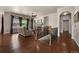Spacious living room with a cozy fireplace, hardwood floors, and large windows at 15616 Soo Line Way, Monument, CO 80132