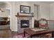 Living room features a stone fireplace and hardwood floors at 15616 Soo Line Way, Monument, CO 80132