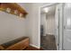 Mud room with a bench, hooks, and tiled floor at 15616 Soo Line Way, Monument, CO 80132