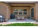 Covered patio with a dining set, grill, and access to a sliding glass door at 15616 Soo Line Way, Monument, CO 80132