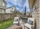 Inviting backyard space featuring a deck, outdoor furniture, and a well-maintained lawn at 16181 White Hawk Dr, Parker, CO 80134