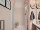 Clean and modern bathroom featuring a glass-enclosed shower with a tiled bench and sleek fixtures at 16181 White Hawk Dr, Parker, CO 80134