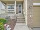 Inviting front entrance with well-manicured landscaping leading up to the front door at 16181 White Hawk Dr, Parker, CO 80134