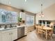 Eat-in kitchen area with natural lighting and views at 16181 White Hawk Dr, Parker, CO 80134
