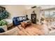 Comfortable living room featuring hardwood floors and an inviting blue sofa and decor at 16181 White Hawk Dr, Parker, CO 80134