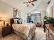 Relaxing main bedroom featuring a vaulted ceiling, large window, and plush bedding with decorative pillows at 16181 White Hawk Dr, Parker, CO 80134