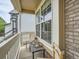 Cozy porch seating area offers a relaxing outdoor space with natural light and neighborhood views at 16181 White Hawk Dr, Parker, CO 80134