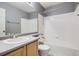 Clean bathroom, bathtub, shower, and gray vanity at 16641 Martingale Dr, Parker, CO 80134