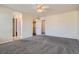 Primary bedroom with ceiling fan and en-suite bathroom at 16641 Martingale Dr, Parker, CO 80134