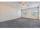 Bright bedroom with ceiling fan and two windows at 16641 Martingale Dr, Parker, CO 80134