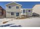 Two-story house with backyard and snow at 16641 Martingale Dr, Parker, CO 80134