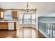 Eat-in kitchen with wood cabinets, stainless steel appliances, and a bay window at 16641 Martingale Dr, Parker, CO 80134
