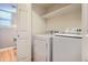 Laundry room with washer, dryer, and shelving at 16641 Martingale Dr, Parker, CO 80134