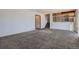 Living room with gray carpet and view of the kitchen and stairs at 16641 Martingale Dr, Parker, CO 80134