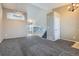 Open living room and dining area with gray carpet, high ceilings, and a view to the kitchen at 16641 Martingale Dr, Parker, CO 80134