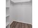 Walk-in closet with shelving and hardwood flooring; a convenient storage solution at 8826 E Florida Ave # G11, Denver, CO 80247