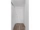 Apartment entryway with wood flooring, closet, and a white door, offering a glimpse of the interior at 8826 E Florida Ave # G11, Denver, CO 80247