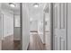 Bright hallway with modern flooring, fresh paint, and natural light at 8826 E Florida Ave # G11, Denver, CO 80247