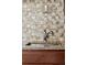 Modern kitchen sink with a chrome faucet and stylish tiled backsplash at 8826 E Florida Ave # G11, Denver, CO 80247
