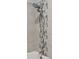 Spa-like shower featuring dual shower heads and elegant tile work at 8826 E Florida Ave # G11, Denver, CO 80247