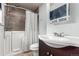 Bathroom with walk in tub, shower and vanity with sink at 710 4Th St, Bennett, CO 80102