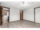 Bedroom with wood trim, closet and ensuite bathroom featuring a walk in shower at 710 4Th St, Bennett, CO 80102