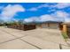 Exterior view displaying the spacious driveway and the two-car garage, enhancing curb appeal at 710 4Th St, Bennett, CO 80102