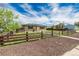 Charming single-story home featuring a brick exterior and a rustic wooden fence at 710 4Th St, Bennett, CO 80102